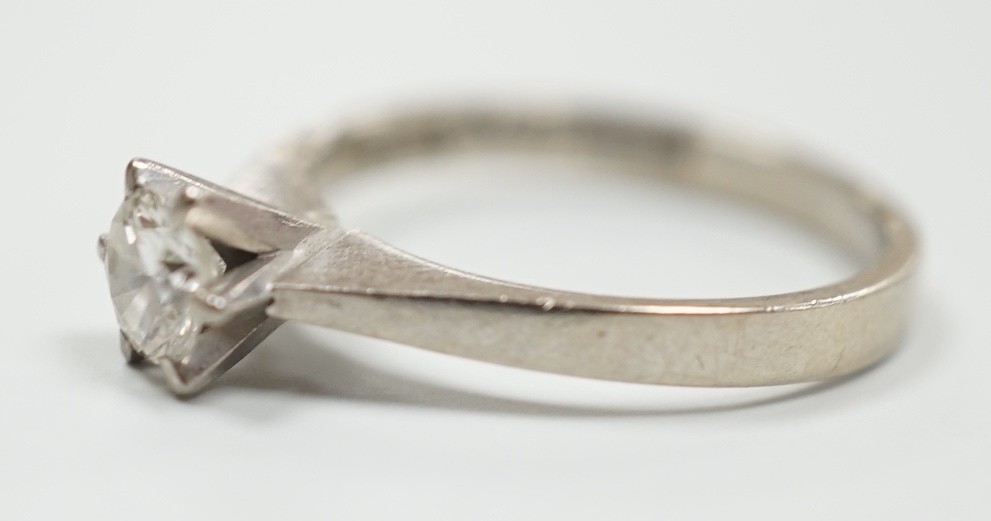 A modern Swedish 18k white metal and solitaire diamond set ring, size K, gross weight 2.6 grams